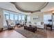 Bright living room features neutral decor, large windows with views, and comfortable seating at 1289 Diamond Ridge Cir, Castle Rock, CO 80108