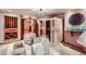 This luxurious space features cozy chairs, soft lighting, and a wine cellar, perfect for relaxing or entertaining guests at 1289 Diamond Ridge Cir, Castle Rock, CO 80108