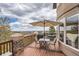 Relaxing outdoor deck with views, an umbrella, a table, a grill, and chairs perfect for outdoor dining at 1289 Diamond Ridge Cir, Castle Rock, CO 80108
