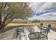 Inviting patio with comfortable seating, set against a backdrop of a lush lawn and open sky at 1289 Diamond Ridge Cir, Castle Rock, CO 80108