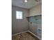 Functional laundry room featuring a shelf and utility hookups, providing a convenient space for laundry tasks at 6071 Caribou Dr, Brighton, CO 80601