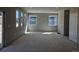 Bright living room featuring natural light from multiple windows, offering a blank canvas for personalization at 6071 Caribou Dr, Brighton, CO 80601