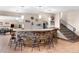 Finished basement featuring a bar with seating and modern lighting at 6170 Falcon Ln, Morrison, CO 80465