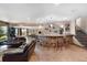 Finished basement bar with seating and decorative shelving at 6170 Falcon Ln, Morrison, CO 80465