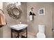 Charming bathroom featuring modern fixtures, unique mirror, and stylish decor at 6170 Falcon Ln, Morrison, CO 80465