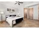 Comfortable bedroom featuring light walls and tan floors with art decorations at 6170 Falcon Ln, Morrison, CO 80465