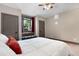 Comfortable bedroom features a queen bed, accent window seat, two closets and neutral tones at 6170 Falcon Ln, Morrison, CO 80465