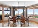 Dining room with large windows, and stylish lighting at 6170 Falcon Ln, Morrison, CO 80465