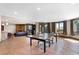 Spacious game room with ping pong table and adjacent sitting area at 6170 Falcon Ln, Morrison, CO 80465
