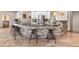 Kitchen island features stylish seating and stone facade at 6170 Falcon Ln, Morrison, CO 80465