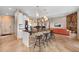 Open-concept kitchen with large island and pendant lighting at 6170 Falcon Ln, Morrison, CO 80465