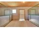 Individual horse stall with sand flooring and metal gate at 10690 County Road 1, Longmont, CO 80504