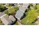 Overhead view of a home's roof and backyard, showing its nice lawn and adjacent houses in the neighborhood at 16225 Peregrine Dr, Parker, CO 80134