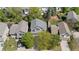 Overhead view of a suburban home nestled among lush greenery, showcasing its mature trees and landscaping at 16225 Peregrine Dr, Parker, CO 80134