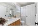 Well-lit bathroom featuring a vanity with sink and mirror, plus a shower with curtain at 16225 Peregrine Dr, Parker, CO 80134