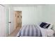 Cozy bedroom with a comfortable bed and an open door showcasing the hallway at 16225 Peregrine Dr, Parker, CO 80134