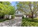 Well-maintained home featuring a lush front yard and mature trees providing shade at 16225 Peregrine Dr, Parker, CO 80134