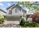Charming two-story home featuring a well-manicured front yard and an attached two-car garage in a suburban neighborhood at 16225 Peregrine Dr, Parker, CO 80134