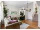 Comfortable living room with hardwood floors, a fireplace, and a staircase leading to the second floor at 16225 Peregrine Dr, Parker, CO 80134
