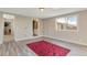 Bedroom with large window and gray flooring at 6528 S Louthan St, Littleton, CO 80120