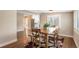 Open dining room with hardwood floors and large window at 6528 S Louthan St, Littleton, CO 80120