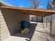 Exterior shot showing storage area with partial roof and pea gravel yard at 6528 S Louthan St, Littleton, CO 80120