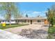 A quaint home with an inviting front yard and a driveway for parking at 6528 S Louthan St, Littleton, CO 80120