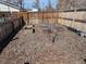 Backyard garden plot area, ready for planting, surrounded by wooden fencing at 6528 S Louthan St, Littleton, CO 80120
