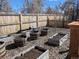 Backyard garden featuring several raised beds with rich soil ready for planting at 6528 S Louthan St, Littleton, CO 80120