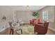 Cozy living room with designer chairs, rug, and lighting on hardwood floors at 6528 S Louthan St, Littleton, CO 80120