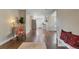 Spacious living area with hardwood floors that opens to modern kitchen at 6528 S Louthan St, Littleton, CO 80120