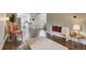 Inviting living area with hardwood floors that flows into a stylish kitchen at 6528 S Louthan St, Littleton, CO 80120