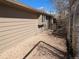 Side yard with gravel ground cover and fence to offer privacy at 6528 S Louthan St, Littleton, CO 80120