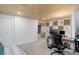 Finished basement with workspace and seating; ideal for a home office at 11420 E 1St Ave, Aurora, CO 80010
