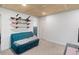 Finished basement office area features desk and decorative snowboard display at 11420 E 1St Ave, Aurora, CO 80010