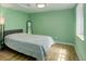 Inviting bedroom featuring warm hardwood floors and large windows for natural light at 11420 E 1St Ave, Aurora, CO 80010