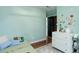 Charming bedroom with space-themed décor, a twin bed, and a dresser offering a creative and playful environment at 11420 E 1St Ave, Aurora, CO 80010