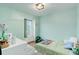 Cozy bedroom featuring a twin bed, a window, and a dresser designed for comfort and functionality at 11420 E 1St Ave, Aurora, CO 80010