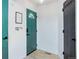 Bright entryway featuring a modern door, plank flooring, and fresh paint at 11420 E 1St Ave, Aurora, CO 80010