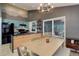 Stylish kitchen with blue cabinets, wood island, black appliances, and an adjacent dining area perfect for gatherings at 11420 E 1St Ave, Aurora, CO 80010