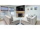 Cozy living room featuring a brick fireplace and comfortable seating at 11420 E 1St Ave, Aurora, CO 80010