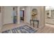 Beautiful foyer with attractive wood floors, decorative accents, and an open view into the flowing layout of the home at 8371 S Cody Way, Littleton, CO 80128