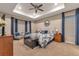 Spacious main bedroom with tray ceiling, bay window and elegant furnishings at 8371 S Cody Way, Littleton, CO 80128