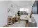 Bright home office with a modern desk, comfortable chair, and plenty of natural light from the window at 10864 Lyric St, Lone Tree, CO 80134