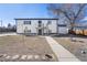 View of backyard including bird bath, storage building, walkway and mature trees at 111 Wolff St, Denver, CO 80219