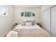 Well-lit bedroom featuring a comfortable bed, neutral decor, and hardwood floors at 111 Wolff St, Denver, CO 80219