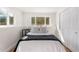 Comfortable bedroom with a window, a closet with sliding doors, and neutral tones at 111 Wolff St, Denver, CO 80219