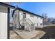 Rear exterior of home with access stairs to door and fenced yard at 111 Wolff St, Denver, CO 80219