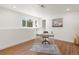 Bright home office featuring a modern desk, neutral decor, and a large window for natural light at 111 Wolff St, Denver, CO 80219