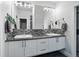 Bathroom featuring double vanity, decorative mirrors, and modern fixtures at 3444 Navajo St # 10, Denver, CO 80211